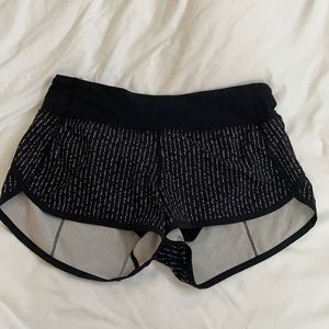 Lululemon Black shorts w writing